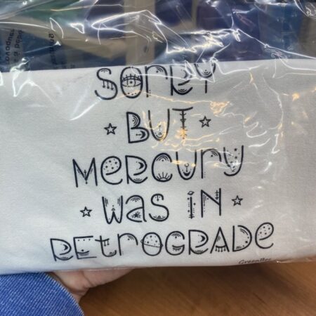 decorative tea towel that says sorry but mercury was in retrograde slightly flawed kitchen tea towel