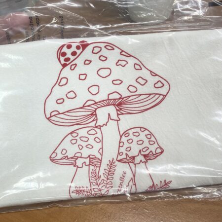 red mushroom on a white tea towel